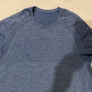 Blue metal tech short sleeve athletic shirt.